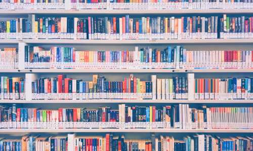 Rows of books in Manchester University Library